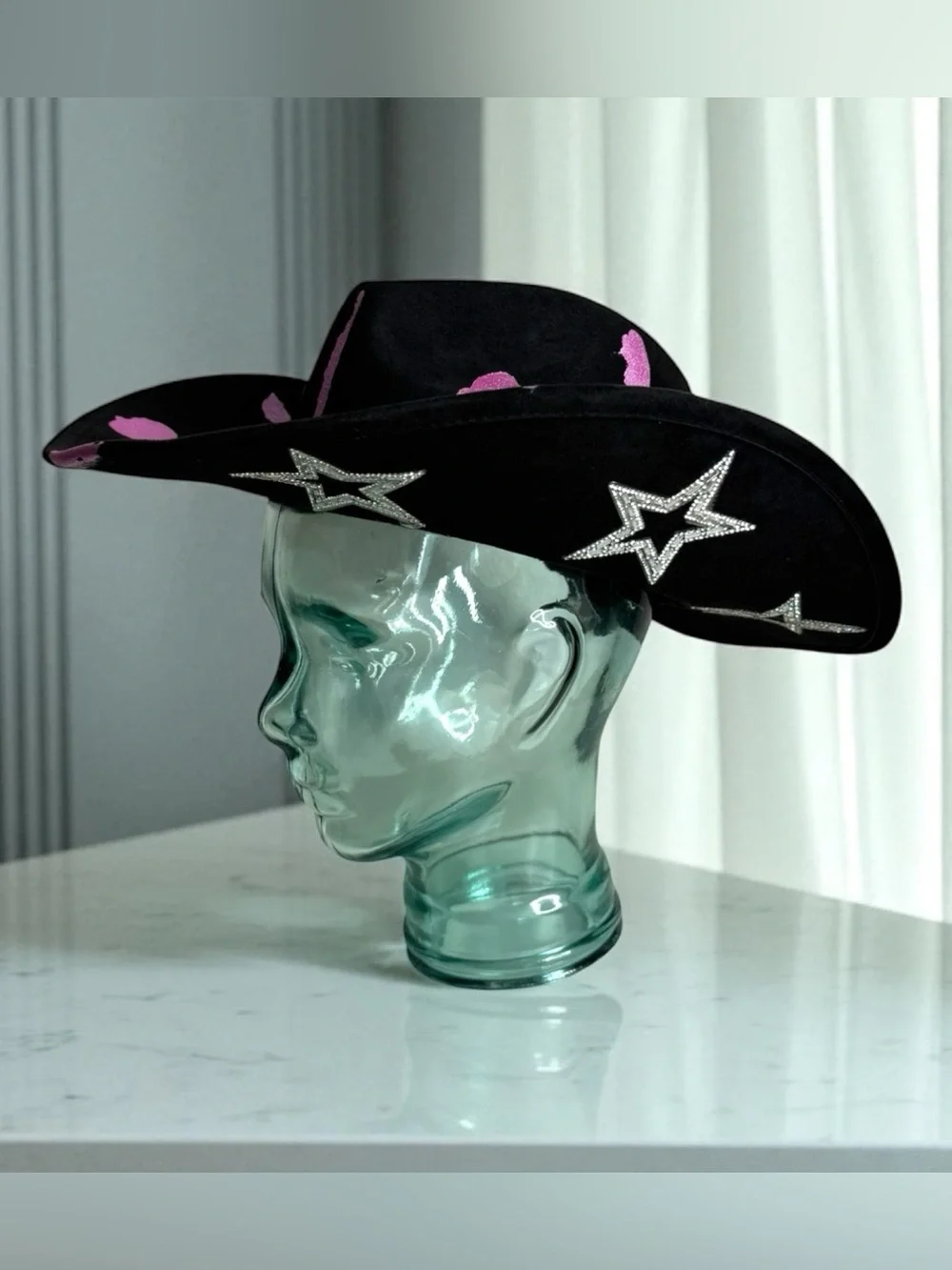 Black Cowboy Hat with Pink Accents and Star Embellishments